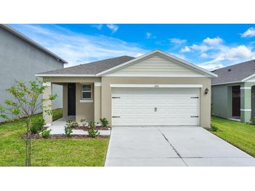 Charming single Gathering home with a two car garage and freshly landscaped front yard at 1221 August Sky Dr, Deltona, FL 32738