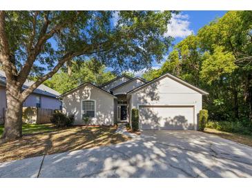Charming single-story home with mature trees and a well-manicured lawn at 2765 Eldred Ct, Apopka, FL 32712