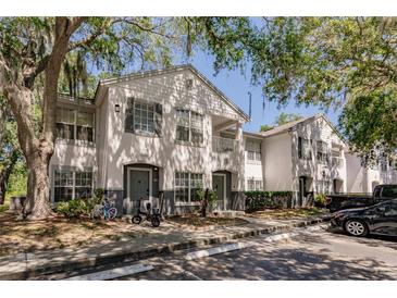 Charming two-story condo with fresh exterior paint, covered parking, and mature tree in a desirable community at 4340 S Kirkman Rd # 901, Orlando, FL 32811