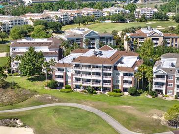Stunning multi-story condo building boasts golf course views and private balconies perfect for enjoying the outdoors at 1112 Sunset View Cir # 302, Reunion, FL 34747