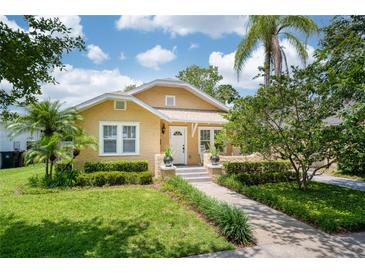 Charming home with landscaped yard, stone walkway, and front porch at 1333 W Yale St, Orlando, FL 32804