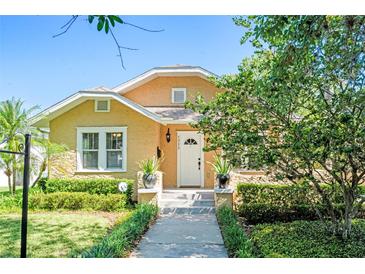Charming home featuring a well-manicured lawn and inviting entrance with mature landscaping at 1333 W Yale St, Orlando, FL 32804