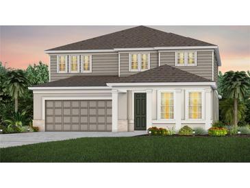 Charming two-story home featuring a two-car garage, neutral color palette, and manicured lawn with garden beds at 4152 Winding Pines Dr, Apopka, FL 32712