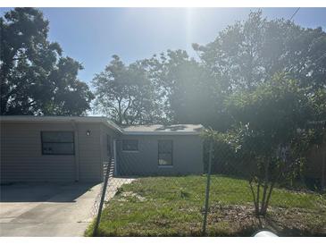 Charming single-story home with a well-kept front yard, fenced for privacy and security at 435 N Observatory Dr, Orlando, FL 32835