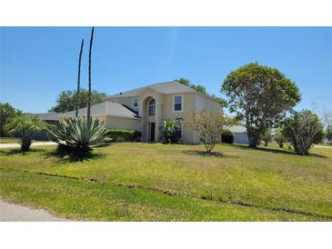 Charming two-story home with lush lawn and mature trees at 502 Eagle Ct, Kissimmee, FL 34759