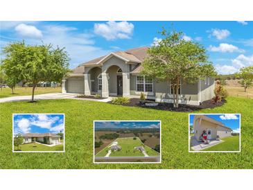 Inviting single-story home featuring a well-manicured lawn, beautiful landscaping, and mature trees at 11630 Flynn Ct, Winter Garden, FL 34787