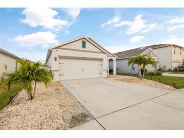 Charming single-Gathering home with a well-maintained lawn, stone accents, and a two-car garage at 3065 Timber Hawk Cir, Ocoee, FL 34761