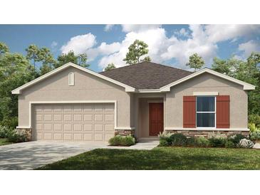 Single Gathering home with stone accents, tan siding, a 2 car garage, brown roof, and manicured landscaping at 4928 Bluebell Ct, Lake Hamilton, FL 33851