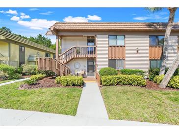 Charming two-story condo with well-maintained landscaping and inviting entrance at 600 N Boundary Avenue # 119A, Deland, FL 32720