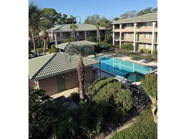 Community pool is nestled among lush landscaping with room for grilling and lounging at 131 Water Front Way # 110, Altamonte Springs, FL 32701
