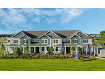 Attractive townhome features modern architecture and a well-manicured lawn, perfect for comfortable living at 15201 Summer Harvest St, Winter Garden, FL 34787