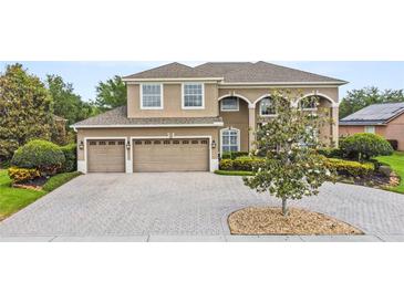 Stunning two-story home with a three-car garage and paver driveway at 2365 Sterling Creek Pkwy, Oviedo, FL 32766