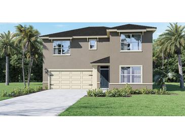 Charming two-story home with a two-car garage, manicured lawn and beautiful landscaping at 2919 Moulin Rd, Davenport, FL 33837
