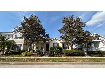 Charming single story home with mature trees and manicured landscaping at 7415 Devereaux St, Reunion, FL 34747