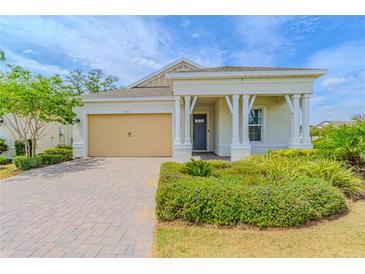 Charming single-story home with a well-manicured lawn and a welcoming front porch at 1598 Whitewood Ct, Kissimmee, FL 34747