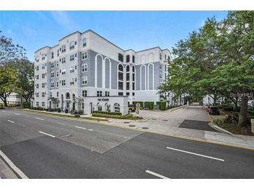 Modern condo building with well maintained landscaping, attractive architecture, and street view at 206 E South St # 3008, Orlando, FL 32801