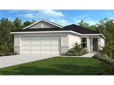 Charming one-story home with a two-car garage, complemented by a lush green lawn and manicured landscaping at 711 Chesnut Ln, Auburndale, FL 33823