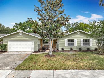 Charming single-story home featuring a well-manicured lawn and inviting front entrance at 236 N Ranger Blvd, Winter Park, FL 32792