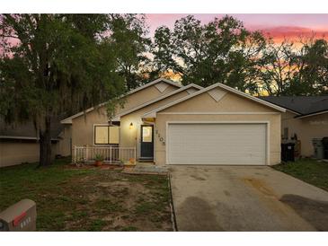Charming single-Gathering home with a well-maintained lawn, and inviting front porch at 1105 Mill Run Cir, Apopka, FL 32703