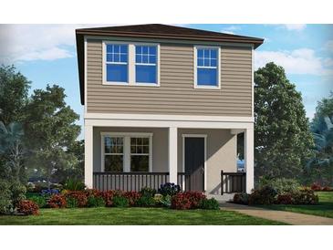 Charming two-story home with a welcoming front porch and beautifully landscaped front yard at 11957 Bracco St, Winter Garden, FL 34787