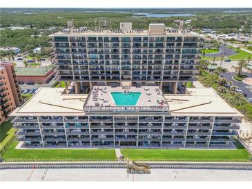 Stunning beachfront condo with pool and ocean views from multiple balconies and easy beach access at 4139 S Atlantic Ave # B707, New Smyrna Beach, FL 32169
