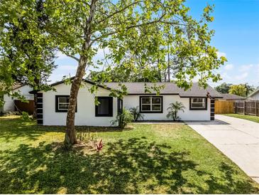 Well-maintained home showcasing fresh landscaping and a spacious front yard, offering a picturesque view at 2412 Yule Tree Dr, Edgewater, FL 32141
