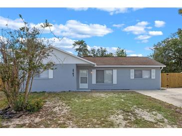 Charming single-story home with a well-maintained lawn and classic architectural details at 2763 E Waco Dr, Deltona, FL 32738