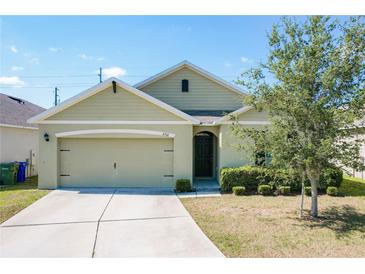 Charming single-story home featuring a two-car garage, well-maintained lawn and manicured shrubbery at 2312 Rose Blvd, Winter Haven, FL 33881