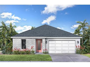 Charming single-story home with a two-car garage and well-maintained lawn surrounded by tropical landscaping at 30330 Emerald Forest Dr, Mount Dora, FL 32757