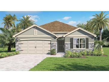 Charming single-Gathering home with a gray stone facade, well-manicured lawn, and a two-car garage at 33616 Seattle Slew Dr, Sorrento, FL 32776