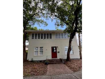 Charming two-story home with classic architecture and mature trees in a desirable neighborhood at 111 E 8Th St, Sanford, FL 32771