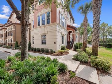 Stunning two-story home with a beautifully landscaped yard and elegant architectural details at 1120 Parma Cir, Lake Mary, FL 32746