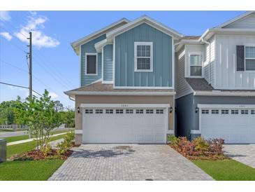Charming two-story townhome with a large garage and beautiful brick driveway at 1341 Wycliffe Way, St Cloud, FL 34771