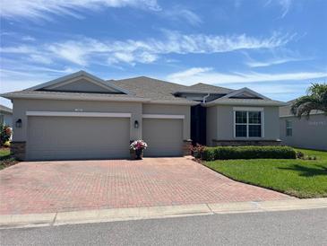 Charming single-story home featuring a brick driveway and a well-manicured lawn at 3998 Bedford Ave, Winter Haven, FL 33884