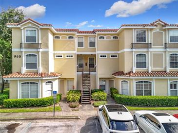 Inviting condo complex with tile roof, landscaping, and convenient parking at 960 Mooring Ave # 202, Altamonte Springs, FL 32714