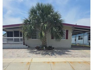 Charming home featuring a well-manicured front yard and a welcoming carport at 138 Maple Dr, Debary, FL 32713