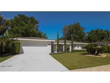 Charming single-story home with a well-manicured front yard and driveway at 1529 Glastonberry Rd, Maitland, FL 32751