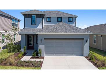 Charming two-story home with a well-manicured lawn and attached two car garage in a Gathering friendly neighborhood at 6728 Great Bear Dr, Lakeland, FL 33805