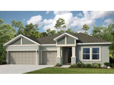 Charming single-Gathering home featuring a two-car garage, a well-manicured lawn, and lush landscaping at 861 Junonia Blvd, New Smyrna Beach, FL 32168