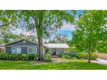 Charming single-story home with a metal roof, lush landscaping and inviting curb appeal at 105 Elizabeth Ave, Altamonte Springs, FL 32701
