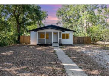 Charming single-story home with a walkway and fenced yard, perfect for outdoor enjoyment at 120 East St, Altamonte Springs, FL 32701