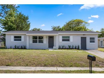 Charming single-story home with well-maintained landscaping and a fresh exterior paint job on a sunny day at 507 Peach Tree Ln, Altamonte Springs, FL 32701
