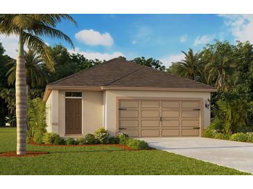 Charming single-story home with a two-car garage, lush landscaping, and a well-manicured lawn at 8379 Madrid St, Lakeland, FL 33810