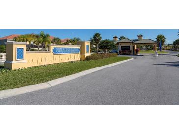 Community entrance featuring attractive sign and access gate for Paradise Palms Resort at 2919 Banana Palm Dr, Kissimmee, FL 34747