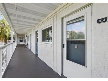 Exterior of condo showing the walkway entrance to unit 214 at 320 Lakeview St # 214, Orlando, FL 32804