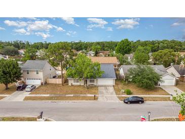 Charming single-story home with mature trees and a well-maintained lawn in a quiet neighborhood at 1993 Excalibur Dr, Orlando, FL 32822