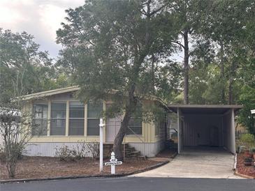 Charming home with a carport and mature trees in a well-kept neighborhood at 551 Pine Needle Ct, Lake Mary, FL 32746