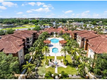 Beautiful aerial view of resort-style apartments and pools with lush landscaping and meticulous grounds at 5530 Metrowest Blvd # 309, Orlando, FL 32811