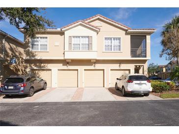 Well-maintained townhome with attached garages and neutral color scheme at 7505 Pellham Way, Kissimmee, FL 34747