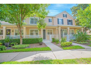 Charming townhome with a landscaped front yard and inviting porch at 9635 Fenrose Ter, Orlando, FL 32827